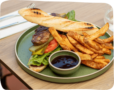 A plate filled with an assortment of food is placed on a table, inviting and ready to be enjoyed.