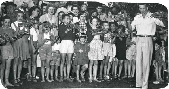 A group of individuals gathers around a man