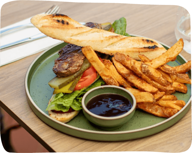 A plate filled with an assortment of food is placed on a table, inviting and ready to be enjoyed
