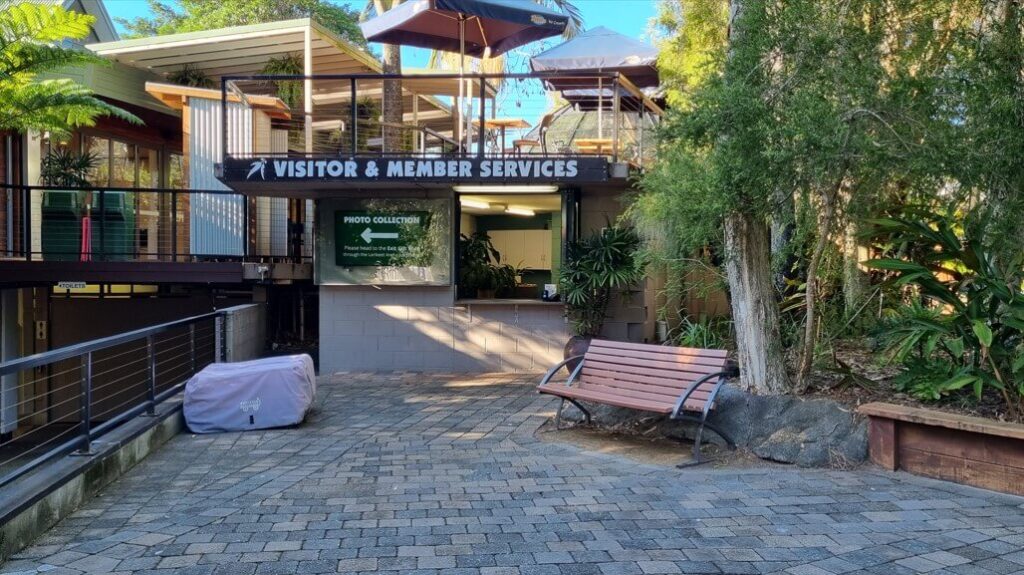 An outdoor visitor and member services area at a park or recreational facility.