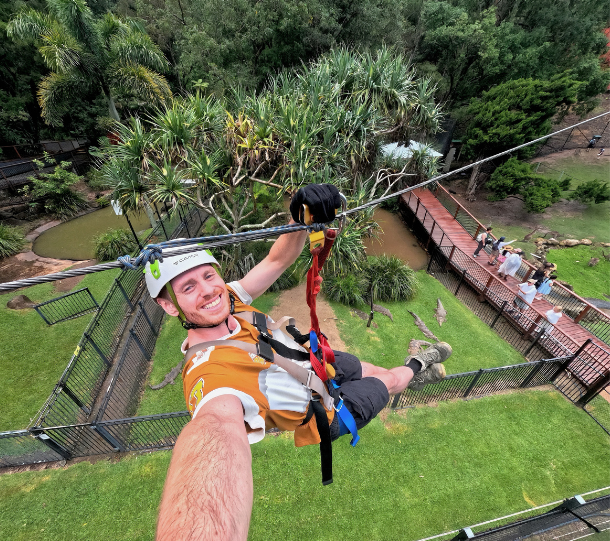 man on zipline treetop challenge currumbin wildlife sanctuary