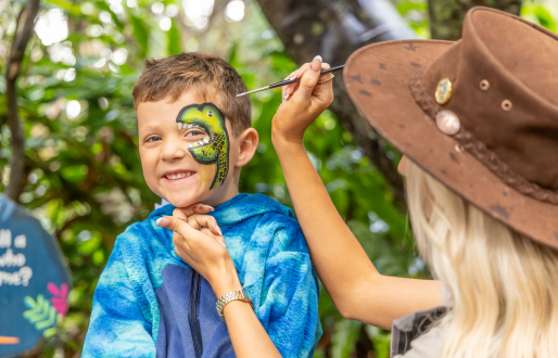 Kids dinosaur-themed face painting